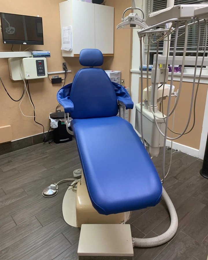 Reupholstered dental patient chair in a professional operatory